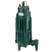Green cast iron submersible sewage pump with metal handle, brass fittings, and four support legs.