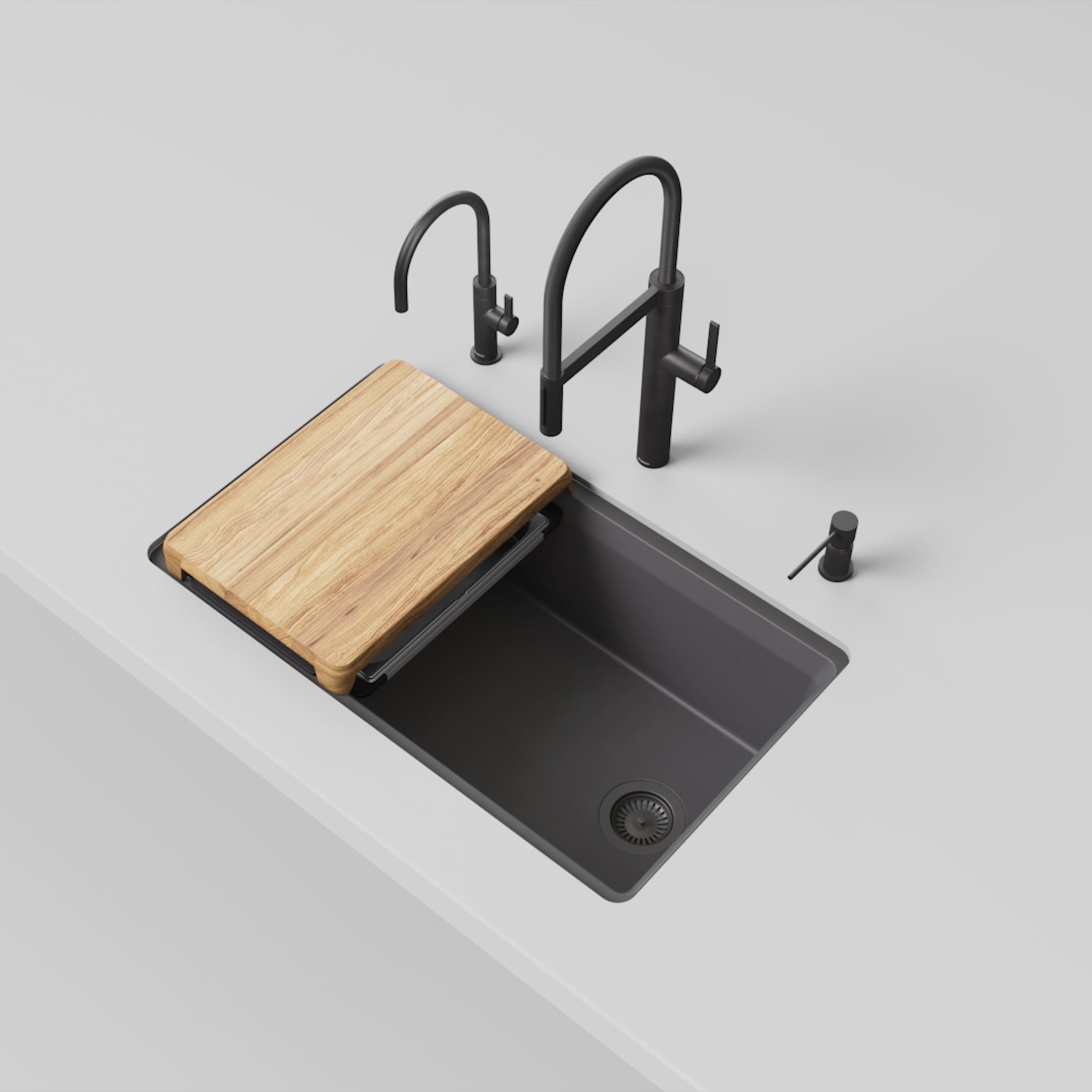 Dark gray rectangular kitchen sink with wooden cutting board, black faucets, and soap dispenser.