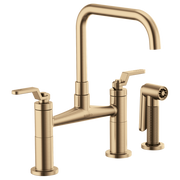 Champagne bronze bridge faucet with square spout, dual lever handles, and side sprayer.