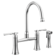 Chrome bridge kitchen faucet with high curved spout, two lever handles, and matching side spray.