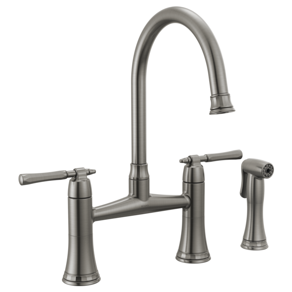Brushed nickel bridge kitchen faucet with curved spout, dual lever handles, and detachable side spray.