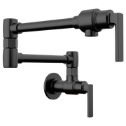 Matte black wall-mounted pot filler faucet with dual articulating arms and lever handle.