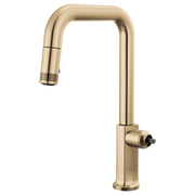 Gold pull-down kitchen faucet with square spout and single side control lever.