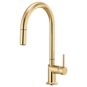 Polished gold widespread bathroom faucet with high arc spout and pull-down sprayer.
