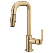 Luxe gold pull-down prep faucet with squared spout, industrial handle, and textured grip on flexible spray head.