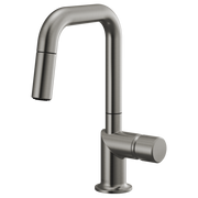 Tall stainless steel single-hole faucet with pull-down spray head and cylindrical handle for vessel sinks.