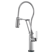 Chrome kitchen faucet with flexible coiled hose, articulating arm, and white lever handle on cylindrical base.