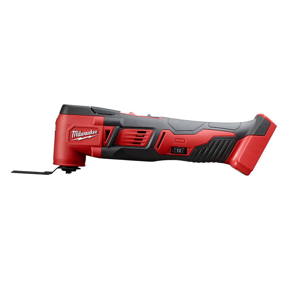 Red and black Milwaukee M18 multi-tool with oscillating blade attachment and battery slot.