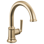 Luxe gold single-handle bathroom faucet with curved spout and cylindrical handle.