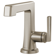 Brushed nickel single-handle lavatory faucet with angular spout and cylindrical lever handle on round base.