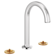 Chrome widespread bathroom faucet with curved arc spout and two brass-finished control bases.