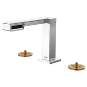 Chrome and white widespread lavatory faucet with brass accent handles and angular spout design.