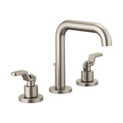 Luxe nickel widespread lavatory faucet with arched spout and two lever handles on circular bases.