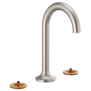 Brushed nickel widespread lavatory faucet with arched spout and two brass-accented handles.