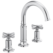 Chrome widespread lavatory faucet with curved arc spout and cross handles on circular bases.
