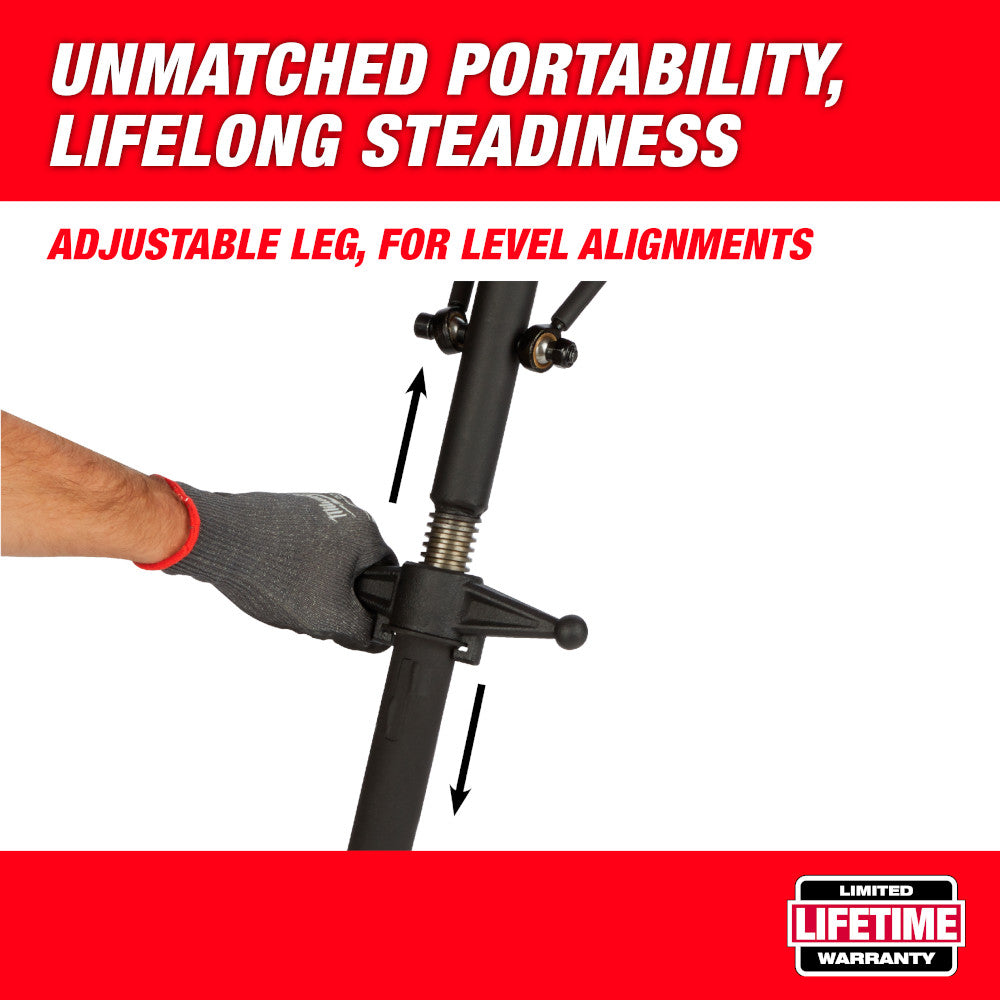 Black portable chain vise with adjustable tripod legs and leveling screw, held by gloved hand.