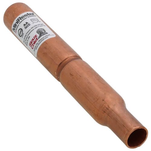Copper water hammer arrestor with white label band and tapered cylindrical body, open end visible.