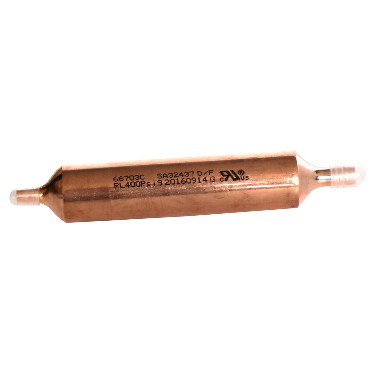Copper cylindrical drier with connector ports at both ends and model specifications stamped on the body.
