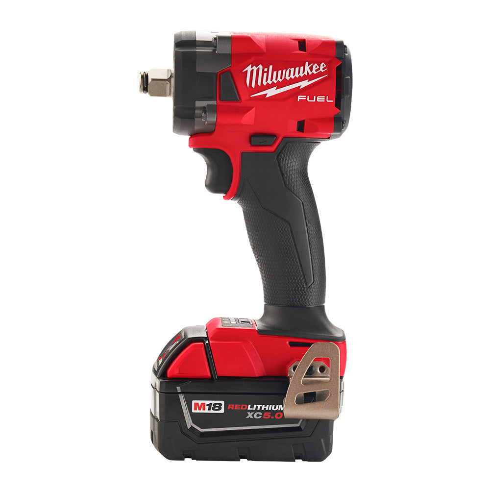 Red and black Milwaukee M18 FUEL compact impact wrench with friction ring and attached lithium-ion battery.