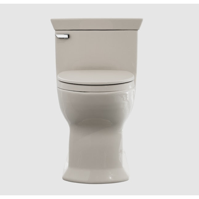 Sedona Beige one-piece elongated toilet with closed soft-close seat and chrome tank lever.