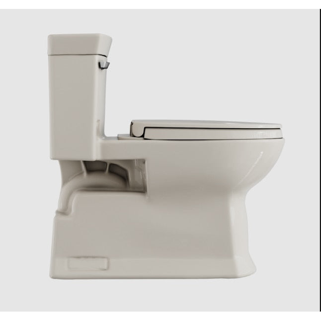 Sedona beige one-piece elongated toilet with soft-close seat and integrated tank.