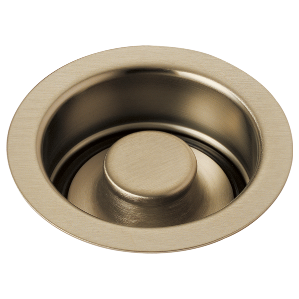 Brushed bronze circular sink stopper with recessed center button and wide flange rim.
