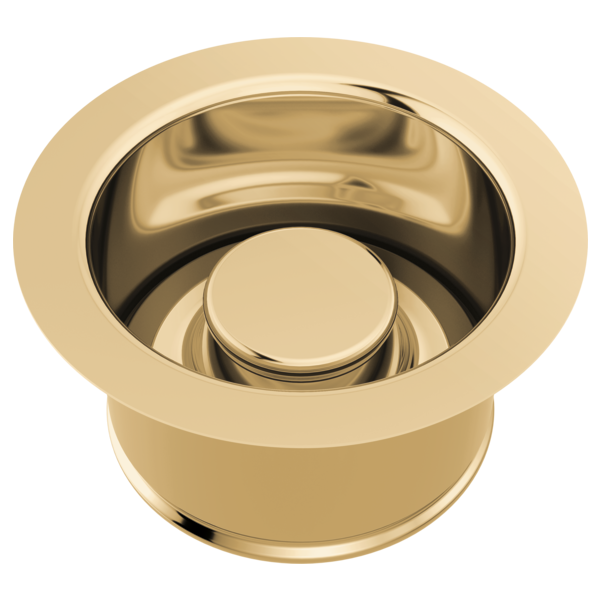 Champagne bronze sink flange with cylindrical stopper and curved rim insert.