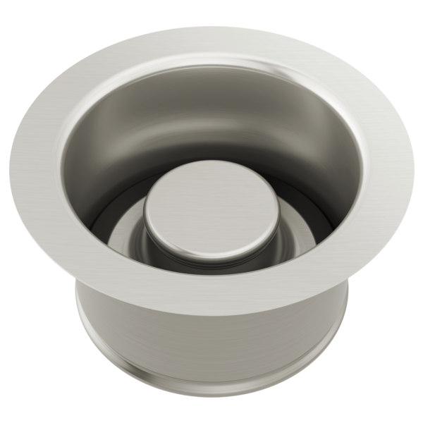 Stainless steel sink disposal flange with white rubber stopper, viewed from above.