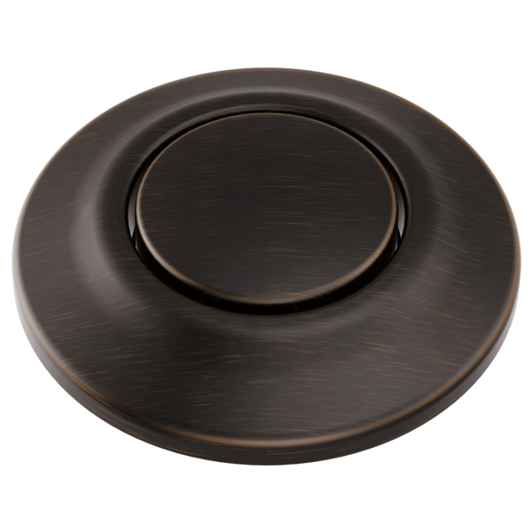 Round oil-rubbed bronze air switch with centered oval button and brushed metal finish.