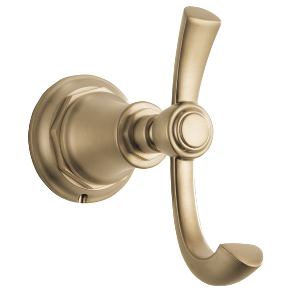 Champagne bronze double robe hook with circular backplate and two curved arms for hanging.