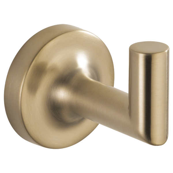 Brushed gold robe hook with circular wall plate and cylindrical protruding hook.