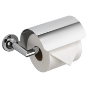 Chrome tissue holder with cylindrical rod and wall-mounted circular base holding a roll of white tissue paper.