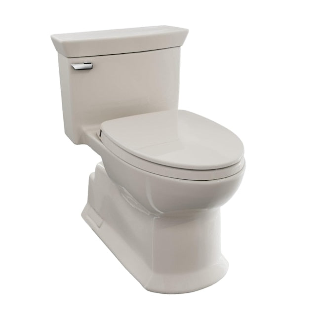 Sedona beige one-piece elongated toilet with soft-close seat and tank handle.