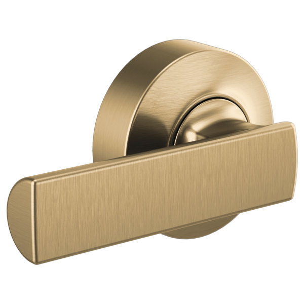 Brushed gold toilet flush lever with rectangular handle mounted on circular escutcheon plate.