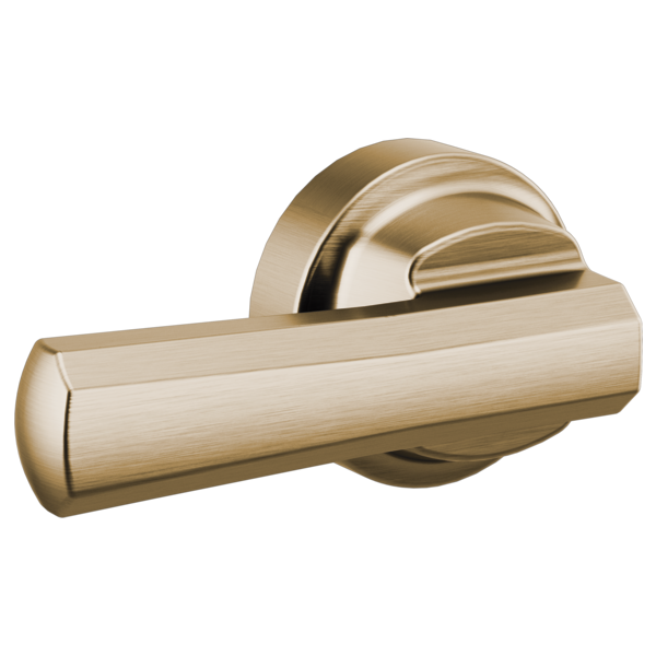 Brushed gold toilet flush lever with cylindrical handle and round mounting plate.