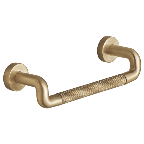 Brushed gold drawer pull with curved handles and textured knurled grip in the center section.
