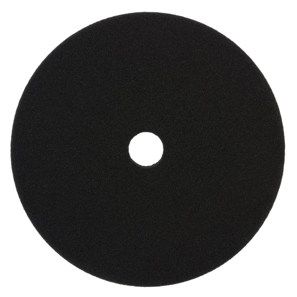 Black foam cutting pad with center hole, 6 inches in diameter.