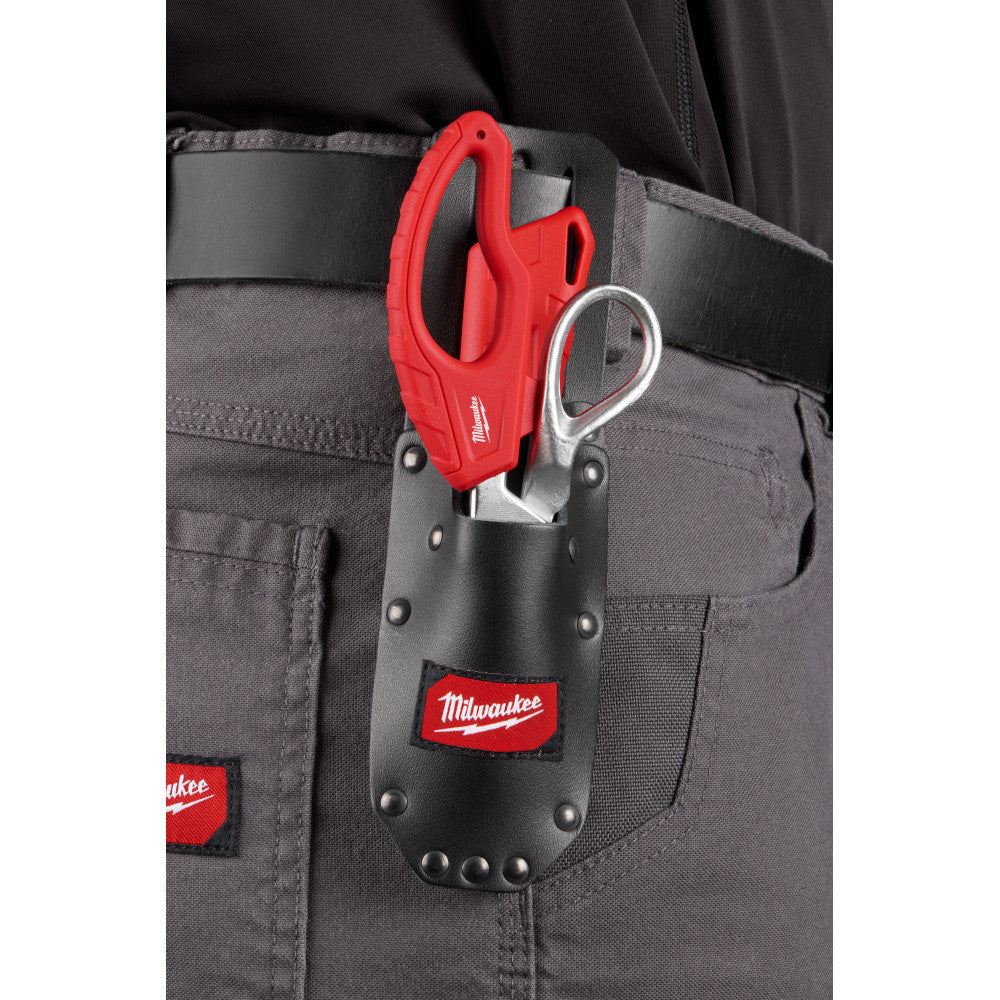 Red cable splicer tool with metal ring and black leather sheath attached to tool belt.