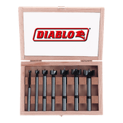 Seven Diablo Forstner bits with black cutting heads arranged in a wooden storage case with lid.