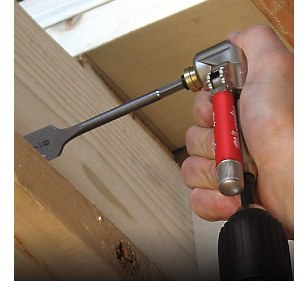 Right angle drill attachment with red handle and flat chisel bit held in hand against wooden surface.