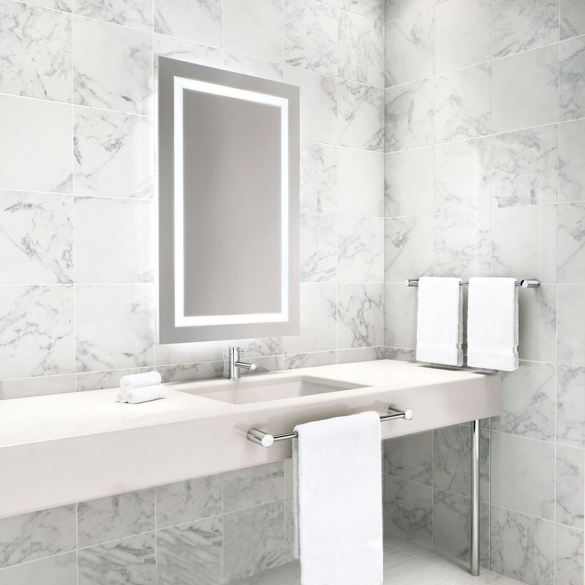 Chrome single-handle bathroom faucet with low-profile spout mounted on marble sink countertop.