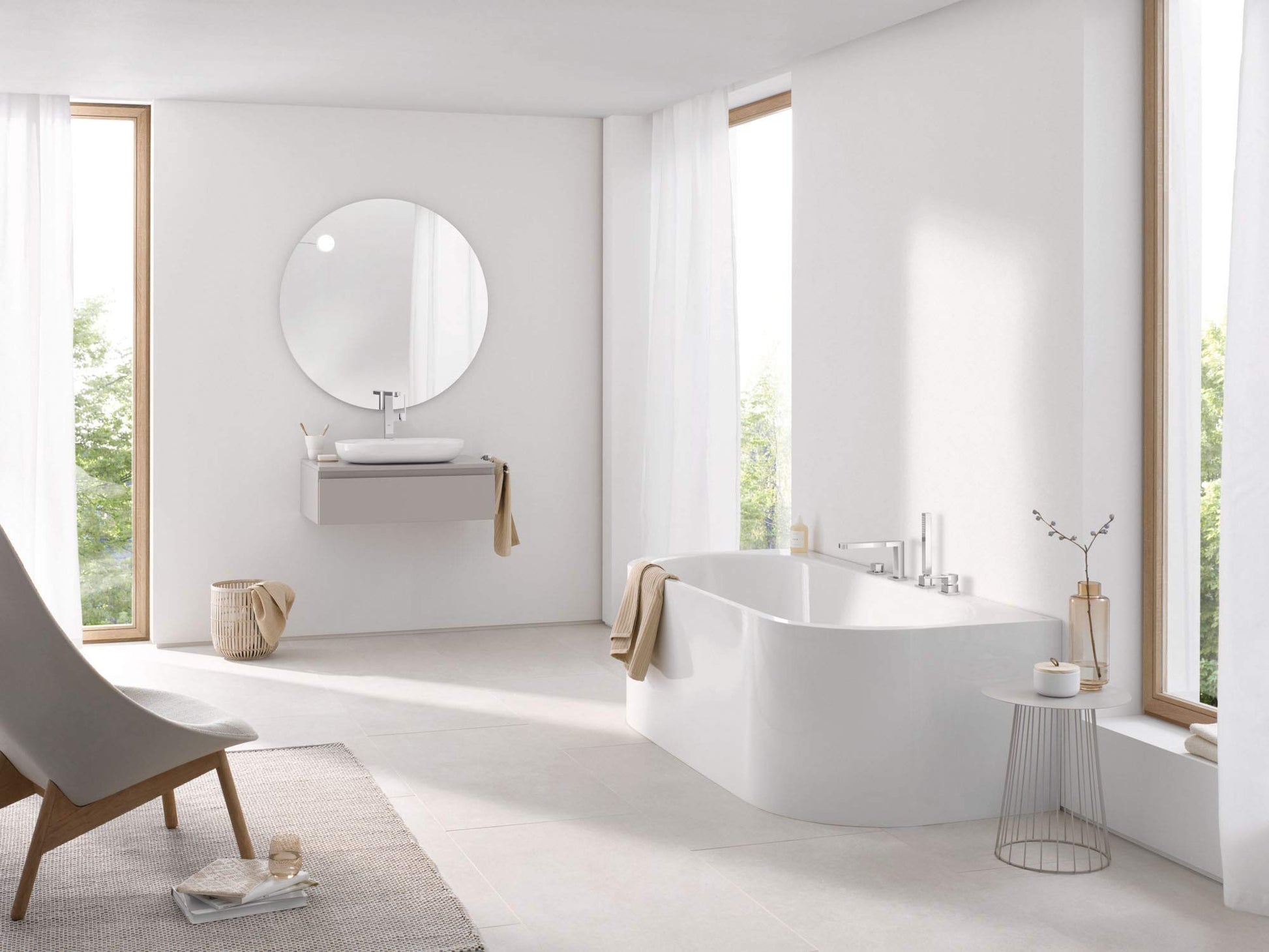 Chrome roman tub faucet with single handle and hand shower mounted on bathtub deck.