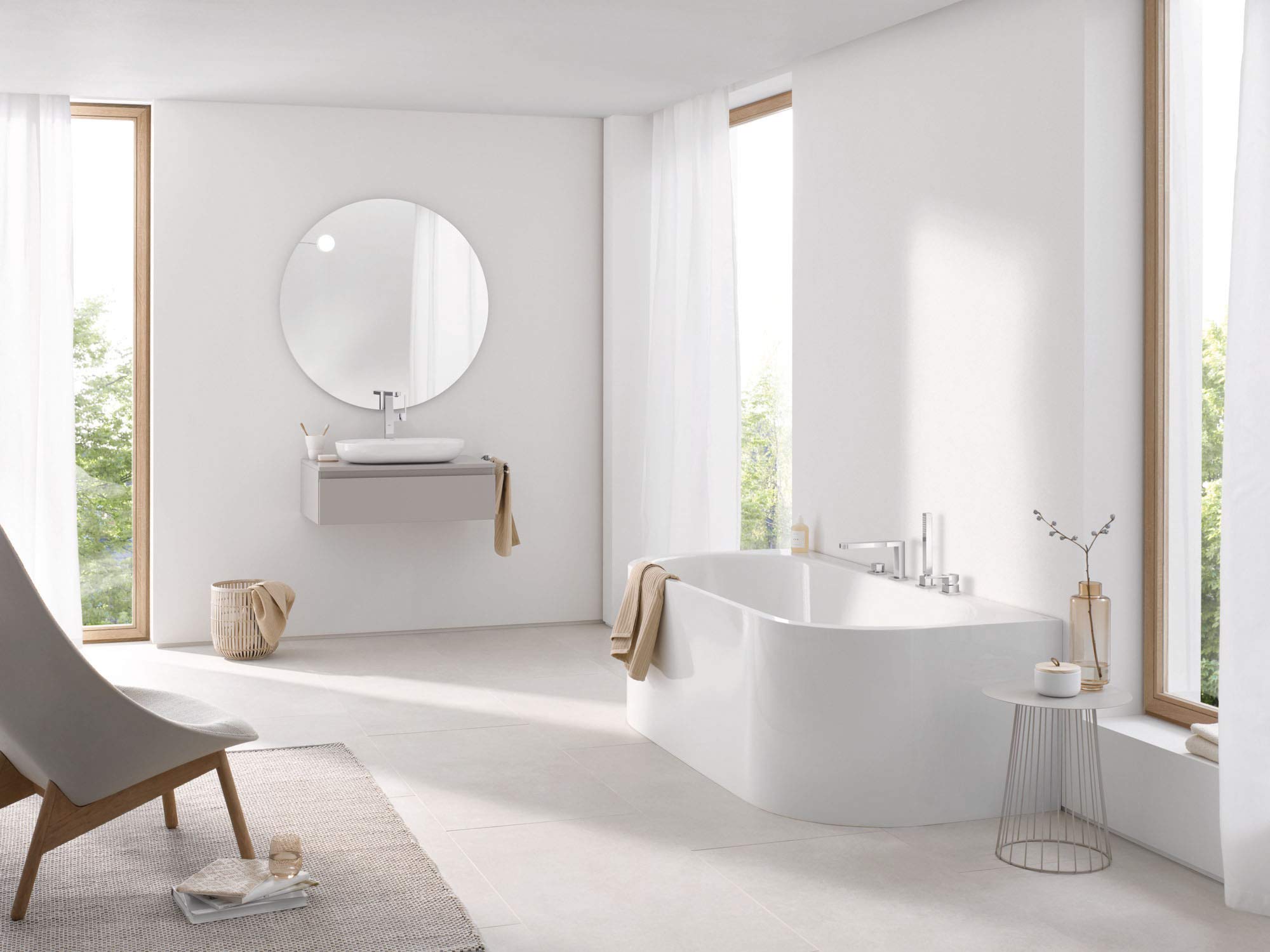 Chrome roman tub faucet with single handle and hand shower mounted on bathtub deck.