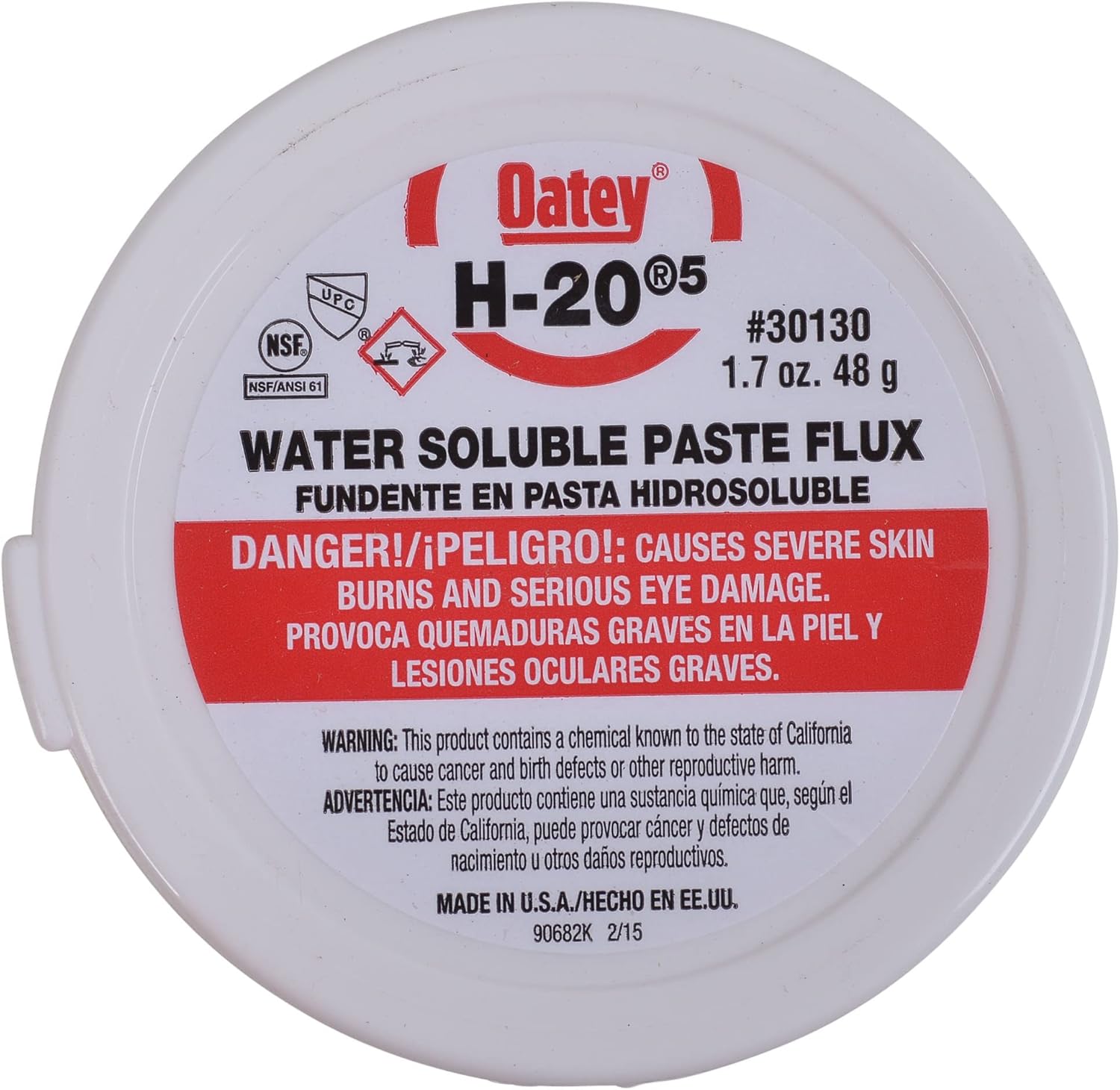White plastic container of Oatey H-20 No. 5 water soluble paste flux with red warning label and product information.