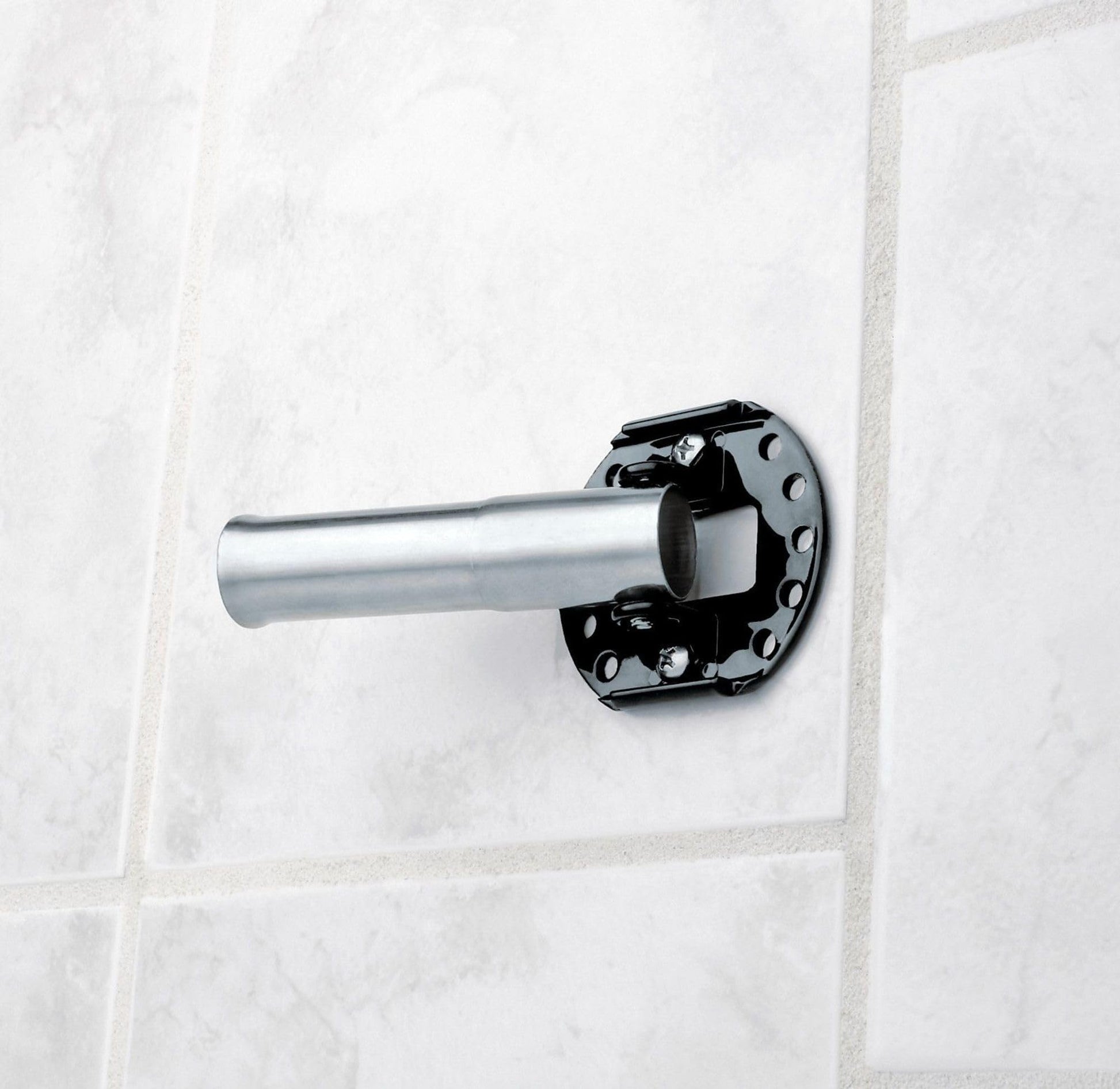 Brushed nickel curved shower rod with black mounting bracket installed on white tile wall.