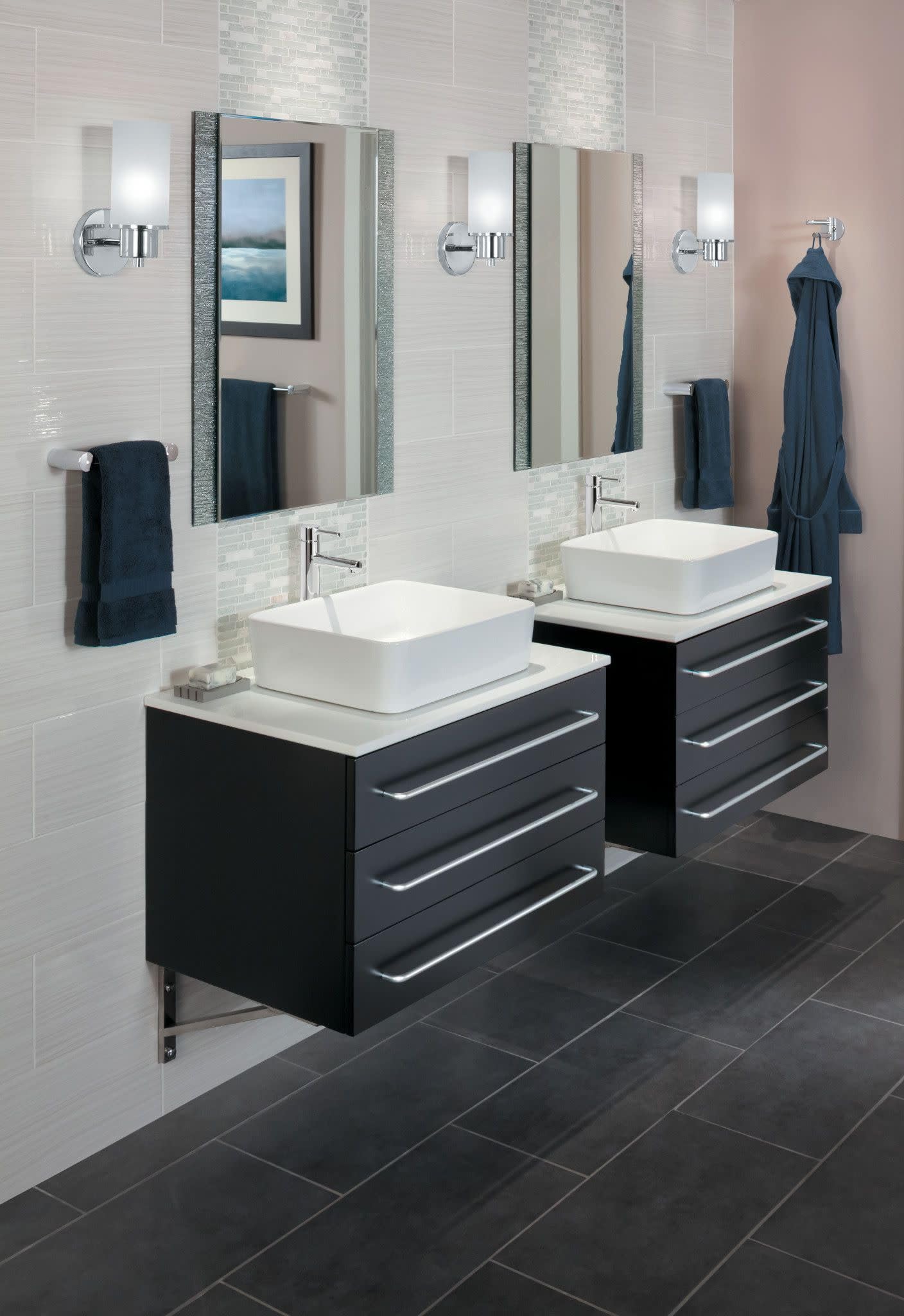 Chrome single-handle vessel sink faucet with tall spout mounted above white square basin in modern bathroom.