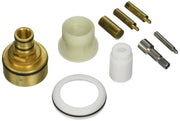 Grohe extension kit components including brass fitting, plastic sleeves, white ring, and metal cartridge parts.