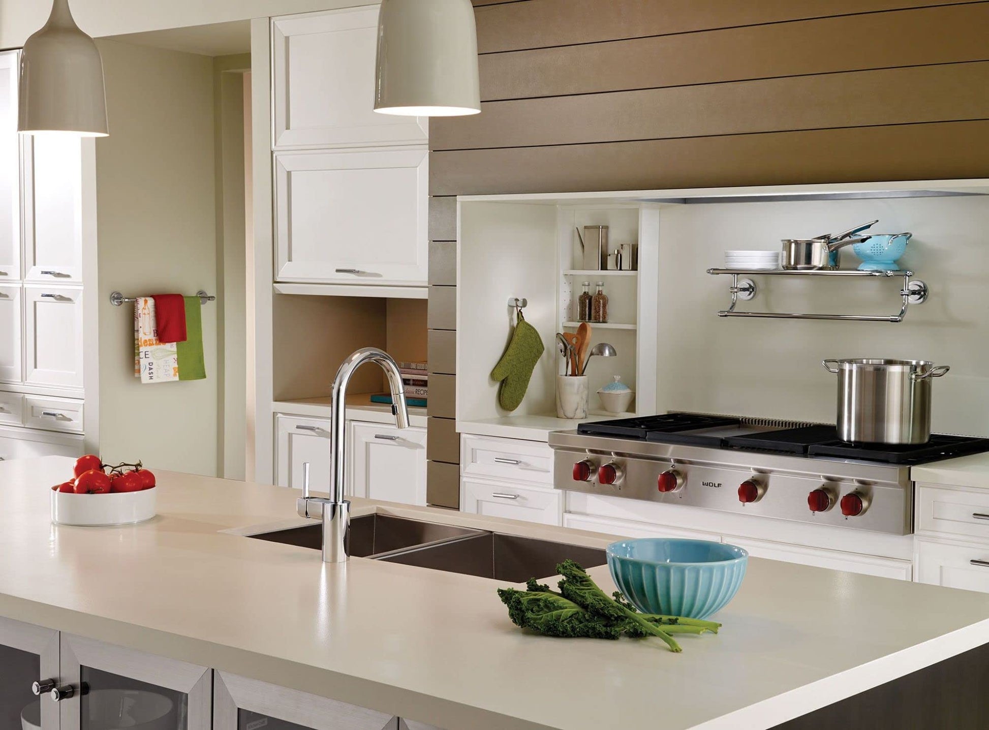 Chrome robe hook with modern minimalist design mounted on kitchen wall.