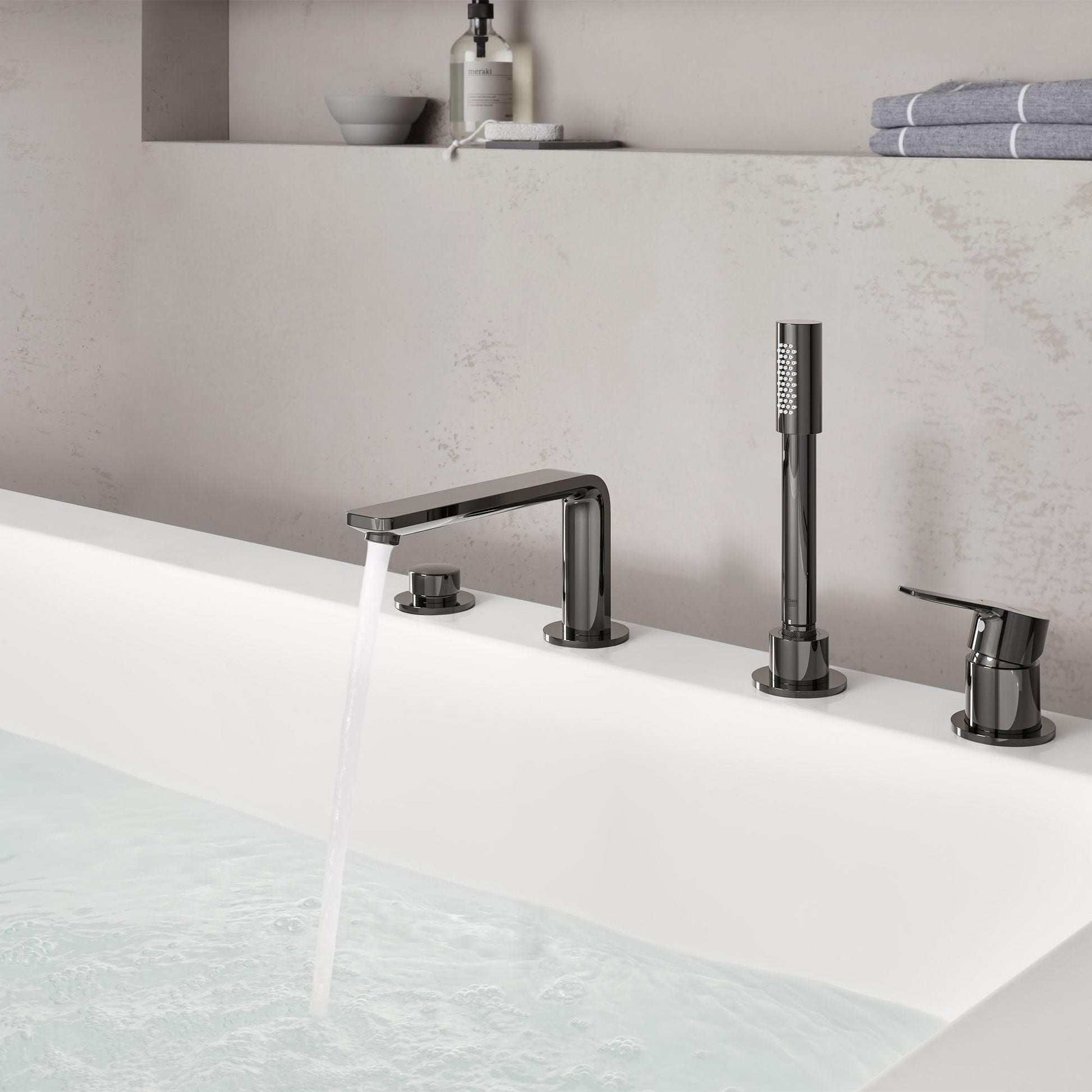 Brushed nickel 4-hole roman tub faucet with single handle spout and matching hand shower mounted on deck edge.