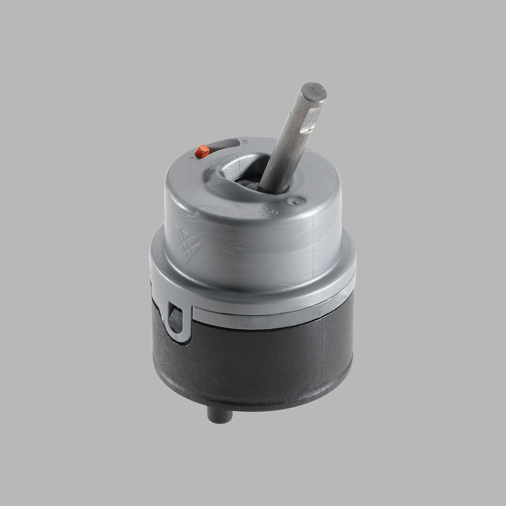 Delta RP50587 cartridge with silver and black cylindrical body, center stem, and red indicator button on top.
